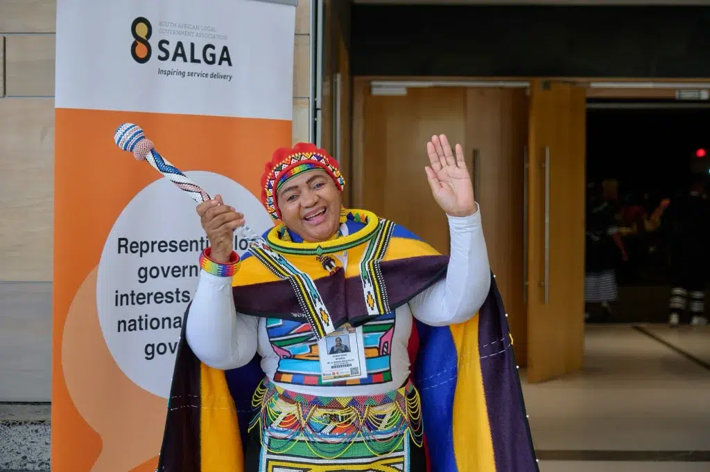 Enthusiastic SALGA delegate in traditional South African attire at SALGA event, captured by Cape Town event photographer