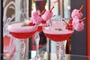 professional corporate event photography: capturing elegant pink cocktails at Mommy Wellness Claremont's launch celebration by Cape Town corporate photographer