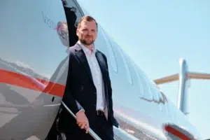 Executive stepping out of private jet
